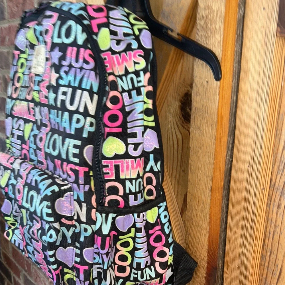 Justice Girls Multicolor Graphic Colorful Glitter and Black Text Backpack